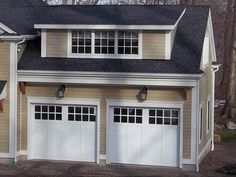 two garages are shown with windows on the top and bottom half of each one