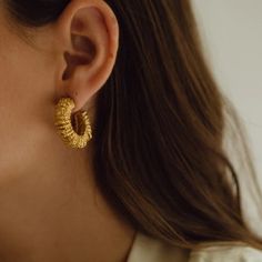 The Paola Sighinolfi Amulet Earrings stand out for their personality and character. These handmade textured mini hoops are sure to be your new go to's 18k Gold Plated 2cm Made in Spain Textured Gold-plated Hoop Earrings, Textured Gold Plated Hoop Earrings, Textured Drop Earrings For Gifts, Handmade Minimalist Gold Plated Huggie Earrings, Textured Gold-plated Jewelry, Handmade Gold-plated Huggie Earrings, Handmade Brass Small Hoop Huggie Earrings, Handmade Gold Plated Huggie Hoop Earrings, Handmade Huggie Gold Plated Hoop Earrings