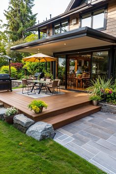 an outdoor deck with patio furniture and umbrella