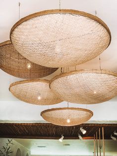 several large woven baskets hanging from the ceiling