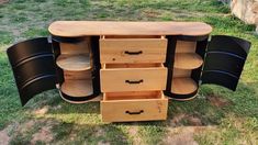 a wooden table with black chairs on it