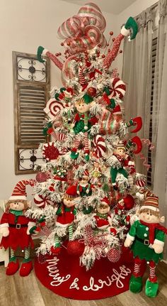 a christmas tree decorated with candy canes and candies