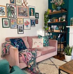 a living room filled with furniture and lots of pictures on the wall above it's fireplace