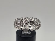 Vintage 925 Silver Cubic Zirconia Eternity Band  Size 10  Item w#3070 This stunning vintage 925 silver cubic zirconia eternity band radiates elegance and sparkle, making it a perfect choice for a wedding band or a chic stackable ring. With its dazzling array of cubic zirconia, this piece adds a touch of luxury to any collection. Its wide design ensures it stands out beautifully, ideal for both special occasions and everyday wear. Size: 10 Material: 925 Silver Weight: 4.7 grams Width: 7.8mm Condi Classic Wedding Diamond Ring With Sparkling Stones, Wedding Diamond Ring In Diamond White With Sparkling Stones, Wedding Diamond White Ring With Sparkling Stones, Wedding Rings In White Gold With Sparkling Stones, White Gold Wedding Rings With Sparkling Stones, Wedding Rings In Diamond White With Sparkling Stones, Wedding Rings With Sparkling Stones, Round Cut, Diamond White Wedding Rings With Sparkling Stones, Wedding Rings With Sparkling Round Cut Stones