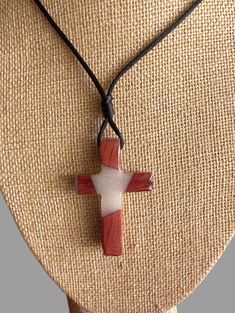 "Handcrafted cedar cross necklace measuring 2\" X 1\". Clearcoat finish with colored resin and adjustable nylon cord. Available in white, blue and green. Actual color and grain pattern may vary due to nature's designs. Perfect gift for 1st communion, confirmation, baptism or for any of your spiritual friends." Adjustable Brown Cross Pendant Necklace, Handmade Adjustable Cross Pendant Necklace, Handmade Adjustable Cross Necklace, Adjustable Red Cross Necklace, Red Adjustable Cross Necklace, Adjustable Brown Cross Necklace, Spiritual Friends, Cedar Walls, Ceramic Crosses