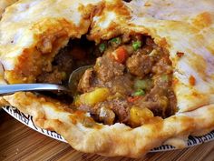 a close up of a pie with a spoon in it