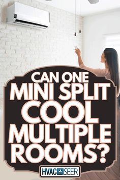 a woman is holding up a sign that says can one mini split cool multiple rooms?