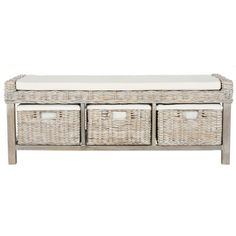 a white bench with three wicker baskets on the bottom and two drawers below it