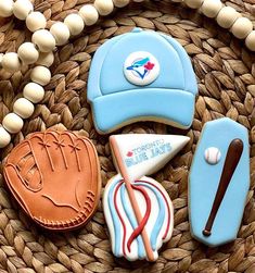 decorated cookies in the shape of baseballs and mitts