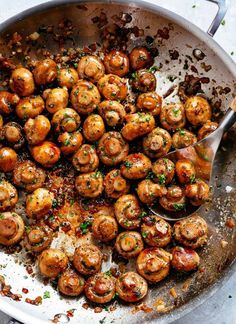 a pan filled with meatballs covered in sauce