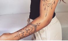 a woman with a tattoo on her arm