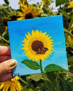 a painting of a sunflower with a monarch butterfly on it's back, in front of some yellow flowers