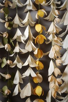 an image of a mobile made out of paper leaves