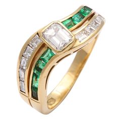 Center Bezel Set 95pt. Emerald cut Diamond set with opposing Channel Set Emeralds & Diamonds. Marked 750 Index Finger Rings For Women, Emerald Diamond Band, Rings For Women Diamond, Index Finger Rings, Oval Diamond Ring, Diamond Band Ring, Sapphire Band, French Cut, Diamond Rings Bands