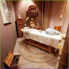 a bed room with a neatly made bed next to a wooden dresser and mirror on the wall