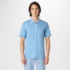 This classic yet stylish short-sleeved polo shirt in 100% Pima cotton features a chest pocket, a quarter zipper closure, a polo collar and double contrast tipping detail, adding a touch of flair to casual. Blue Polo Shirt With Striped Collar For Work, Blue Polo Collar Top With Contrast Trim, Modern Blue Collared Polo Shirt, Zip Polo, Polo Collar, Pima Cotton, Chest Pocket, Quarter Zip, Polo Shirt