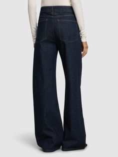 Front button and concealed zip closure. Belt loops. Embellished with crystals. All over pattern placement may vary. Five pockets. Model is wearing a size38 Luxury Bottoms With Five Pockets, Versace Brand, All Over Pattern, Embellished Denim, Wide Jeans, Flat Espadrilles, Jeans Jumpsuit, Swim Accessories, Shearling Jacket