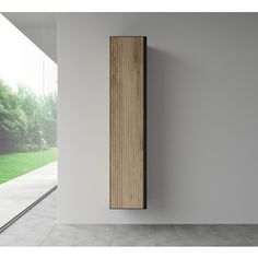 a tall wooden radiator mounted to the side of a wall