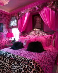 a bedroom decorated in pink and black with leopard print on the bed, curtains, and pillows