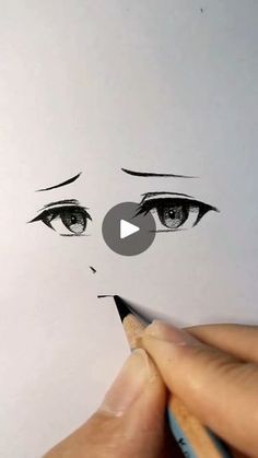 someone is drawing a face with pencils