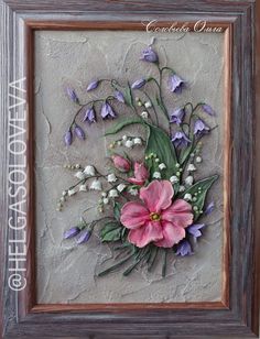 a painting with flowers on it in a frame