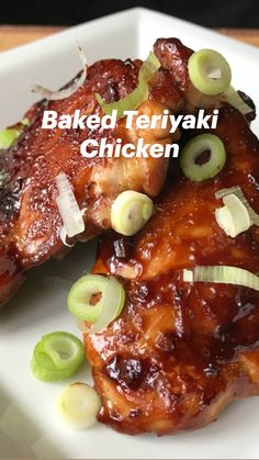 baked teriyaki chicken on a white plate with green onions