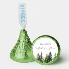 a green foiled herss candy bar with a forest scene on it