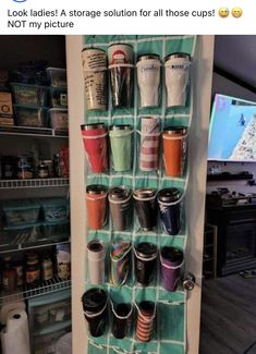 a rack with cups hanging from it's sides