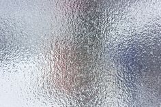 the texture of frosted glass with red and blue highlights on it, as well as an abstract background