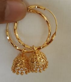 Beautiful pair of gold plated rings with jhumkis for  a attractive look to compliment your ethnic wear Size length1.5  inches Ring diameter 1 inchinch