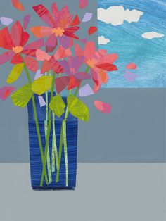 a blue vase filled with red flowers next to a painting