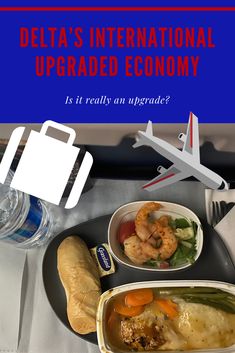 an airplane tray with food on it and the words delta's international upgrade economy is it really an upgrade?