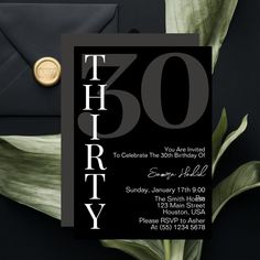 a black and white birthday party card with the number fifty on it, surrounded by greenery