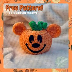 an orange crocheted mouse with a green leaf on its head and the words free pattern by crochet grove