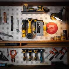 tools are displayed on the pegboard in this garage