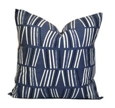 a blue pillow with white stripes on it