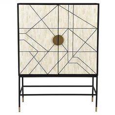 an art deco cabinet with black and white geometric design on the front, gold circles at the top