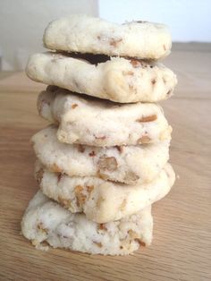 a stack of cookies sitting on top of a wooden table