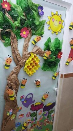 a door decorated with paper flowers and bees