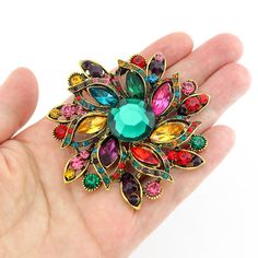 Gorgeous vibrant rhinestone brooch embellishment, which can be used for your DIY project - Vintage wedding, bridal brooch bouquet, ring pillow, gown sash, bridesmaid dress, invitations, cake and frame decorations, event decor, crafts, scrap booking, jewelry gift and much more! Size: 2 1/2 inch high 2 1/2 inches wide Rhinestone color: mix multi color, rainbow Metal: dark gold plated This rhinestone round broach can be ordered with pin in the back to wire into brooch bouquet, add to wedding gown o Multicolor Rhinestone Brooches For Wedding, Multicolor Rhinestone Wedding Brooches, Bouquet Ring, Bridal Brooch Bouquet, Rainbow Metal, Antique Costume Jewelry, Brooch Bouquet, Brooch Bouquets, Dress Pin