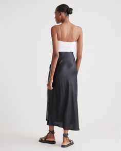 Elevate your wardrobe with our gorgeously drapey 100% Washable Silk Maxi Skirt, a stunning piece that looks effortless but feels incredibly comfortable. Crafted from best-in-class mulberry silk, this luxurious skirt has the same timeless silhouette as our beloved 100% Washable Silk Skirt, just in a longer maxi length. This must-have style is practical too: you can wash it, and the 100% silk fibers naturally nourish your skin and hair.  | Quince | Women's Maxi Skirt in Black, Size XL, Silk Silk Flowy Maxi Skirt With Gathered Details, Silk Maxi Skirt With Flowy Gathered Details, Flowy Silk Midi Maxi Skirt, Silk Maxi Skirt With Gathered Detail, Flowy Silk Maxi Skirt, Midi Length, Silk Midi Length Maxi Skirt, Elegant Midi-length Rayon Slip Dress, Summer Silk Flowy Maxi Skirt, Summer Silk Asymmetrical Maxi Skirt