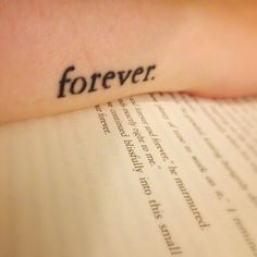 the word forever is written on top of an open book