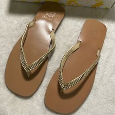 Brand New Never Worn Awesome Tan With Pretty Rhinestones Embellished On The Gold Straps. Perfect For Summer! Gold Leather Sandals With Rhinestones, Rhinestone Synthetic Flip Flops For Party, Party Flip Flops With Rhinestones, Leather Sandals With Rhinestones For Beach, Gold Rhinestone Flip Flops For Vacation, Gold Embellished Flip Flops For Party, Gold Embellished Party Flip Flops, Party Gold Flip Flops With Rhinestones, Gold Rhinestone Party Flip Flops