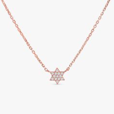 Shlomit This mini diamond Jewish star is perfectly delicate and dainty! This makes a beautiful piece for any age and would be extra special as a Bat Mitzvah gift. Available in Yellow Gold, White Gold, and Rose Gold. - Handmade- Solid Gold- Natural Diamonds- Total Diamond Carat Weight: .07 ctw- Dimensions of Star: 6 x 5 mm All pieces come beautifully boxed in suede pouches you can always use (which really comes in handy when traveling!) Star Of David Necklace, Jewish Star, Bat Mitzvah Gifts, Handmade Fine Jewelry, Diamond Star, Diamond Carat, White Gift Boxes, Star Of David, Rose Gold Necklace