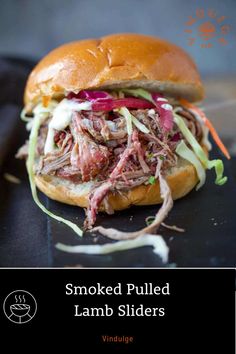 Pulled lamb on a brioche slider bun topped with pickled onions and coleslaw.