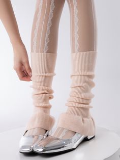 Elevate your look with these ballet-inspired leg warmers. Crafted in a solid color, these knit leg warmers add a touch of elegance to any outfit. The flared design at the bottom gives them a stylish and feminine touch.   Please note that this product includes one pair of leg warmers only. Fitted Knee-high Footless Socks For Fall, Fitted Thigh High Leg Warmers For Fall, Fitted Thigh-high Leg Warmers For Fall, Fitted Knee-high Legwear For Spring, Casual Leg Warmers For Party, Thigh High Leg Warmers For Fall, High Stretch Solid Legwear For Spring, Spring Balletcore Stretch Bottoms, Stretch Balletcore Bottoms