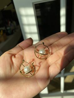 This pair of 3D orbit earring shows a  electron orbit with an artistic twist. + Nickle free gold plated brass + Earrings measure 1 inch in diameter + Come in gift ready package Check out another Orbital earrings design below: https://www.etsy.com/listing/1035554998/orbital-earringschemistry-giftelectron?ref=shop_home_active_2&frs=1 Perfect for gifting! Internally Threaded Dangle Hoop Earrings As Gift, Silver Orb Earrings For Gift, Metal Drop Pearl Earrings For Gift, Internally Threaded Metal Hoop Earrings For Gift, Celestial Metal Hoop Earrings Gift, Celestial Round Metal Earrings, Celestial Style Round Metal Earrings, Internally Threaded Metal Plug Earrings As Gift, Gift Dangle Earrings