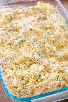 a casserole dish filled with cheese and parmesan sprinkles