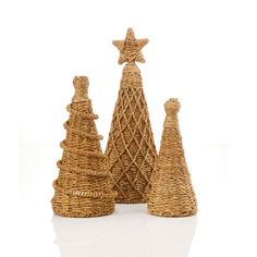 three wicker christmas trees on white background