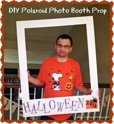 a man in an orange shirt holding up a halloween photo